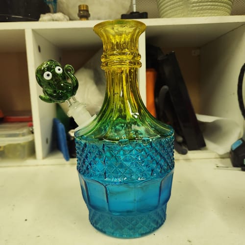 Customer's ombre glass water pipe, shown with the reviewer's own custom green octopus bowl.