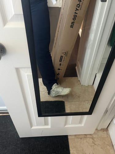 Customer's mirror reflection showing a side view of the light-colored Smart Ⅰ Pro Barefoot Shoes being worn.