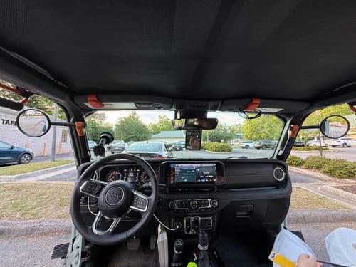 Customer's view from inside a Jeep with doors off, showing the A-Pillar Side Mirror Set providing a clear view on both sides.