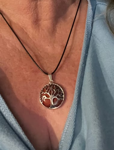 Customer wearing a beautiful jasper stone necklace with a silver-colored Tree of Life pendant.
