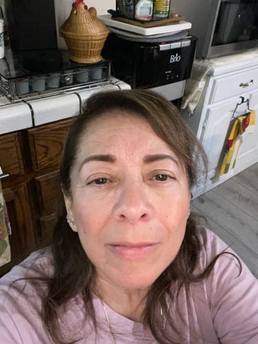 A customer's selfie showing hydrated skin after using Koriderm™ Time Reverse Cream.