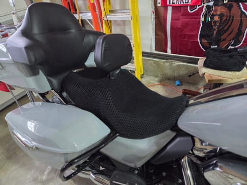 Customer's black Wind Rider Seat Cover installed on a light gray motorcycle seat.