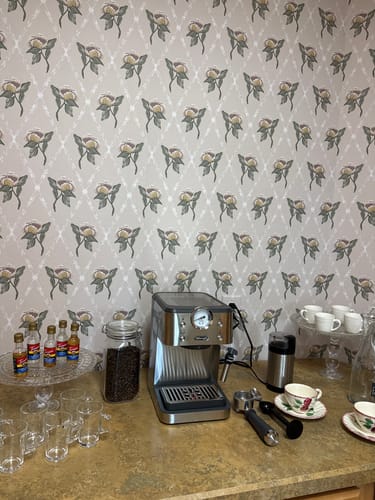 Customer's coffee bar featuring Francie Wallpaper with a floral pattern used as an elegant backsplash.