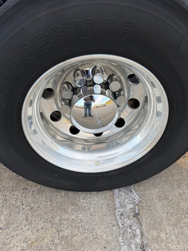 Customer's reflection on a very shiny chrome truck wheel after being cleaned with Absolute Acid.