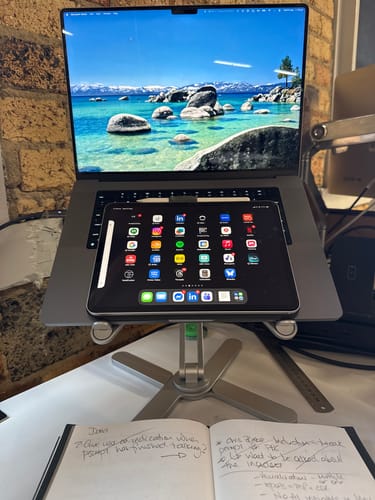 Customer's solid Model-X 2.0 Stand holding a laptop and a tablet for a dual-screen desk setup.