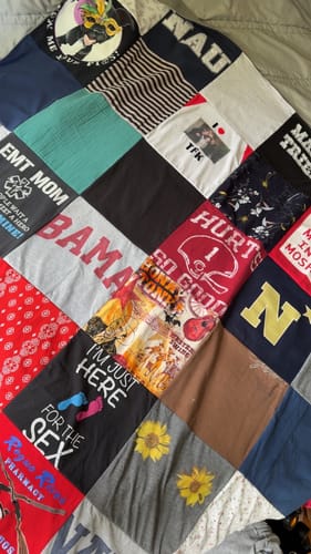 A customer's colorful Project Repat T-Shirt Quilt, created from a patchwork of personal shirts.
