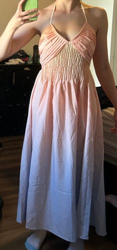 Customer wearing the 1940s Ombre Halter Dress, showing the gathered bodice and pink-to-blue ombre skirt.