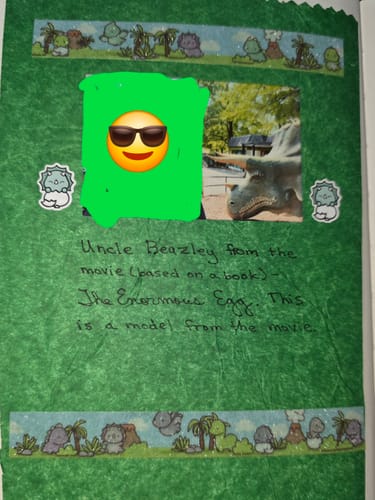 Reviewer's scrapbook page decorated with cute Triceratops Planner Stickers around a photo of a triceratops statue.