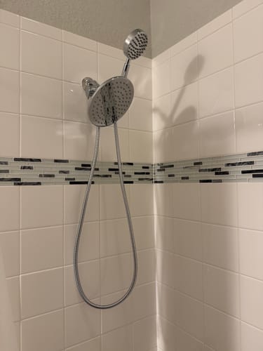 Customer's 1-Spray Dual Shower Head Set installed in a tiled shower.