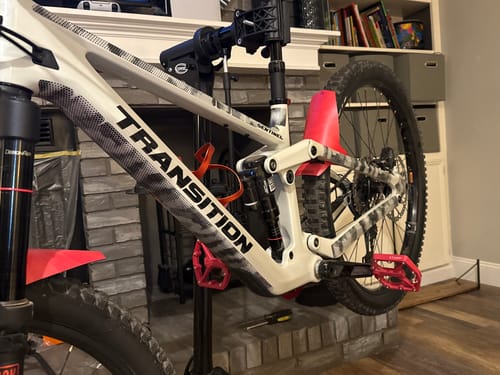 Partial view: Customer's white bike with the Halftone Camo Frame Keeper installed on the seatstays and chainstays.
