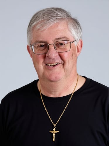 Reviewer smiling while wearing the gold Christ Jewelry Crucifix Pendant Charm Necklace.