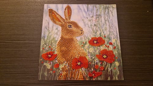 Reviewer's completed 'Wild Poppies and the Hare' Crystal Art Card, showing the sparkling hare among vibrant poppies.