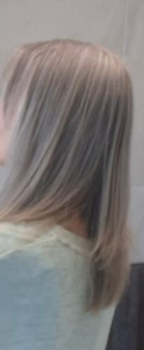 Partial view: Reviewer's soft, multi-tonal hair after using the Rosemary Oil Shampoo & Conditioner.