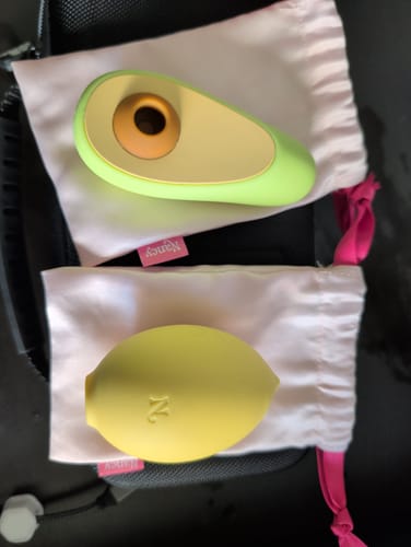 Customer's Tutti Frutti Bundle with the Avo and Lem toys displayed on their individual pink storage bags inside a travel case.