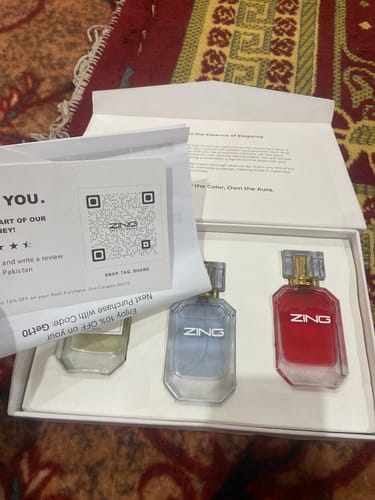 Customer's OUD Supreme BUNDLE showing three different colored fragrance bottles sitting inside the open product box.