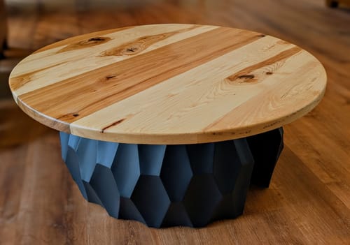 Customer's black Coffee Table Base 201 Alva shown with a round light-wood top on a wooden floor.