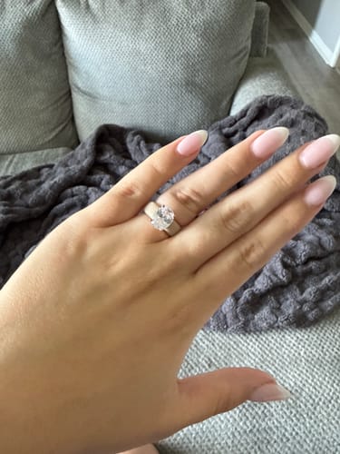 Reviewer showing the Silicone Ring with a large, oval-cut stone on their finger.