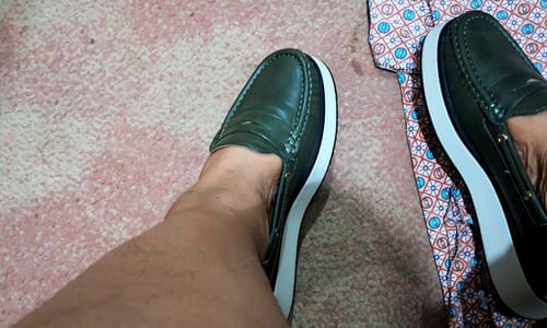 Customer wearing the olive Butterfly Feet Jaime 3 Shoe, showing its thick white platform sole.