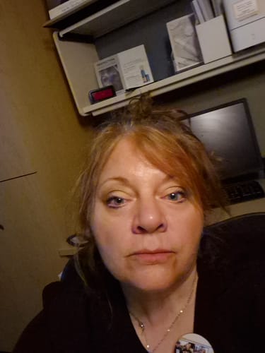 Reviewer's selfie showing her glowing, smooth skin after using the Seranova Micro Infusion System.