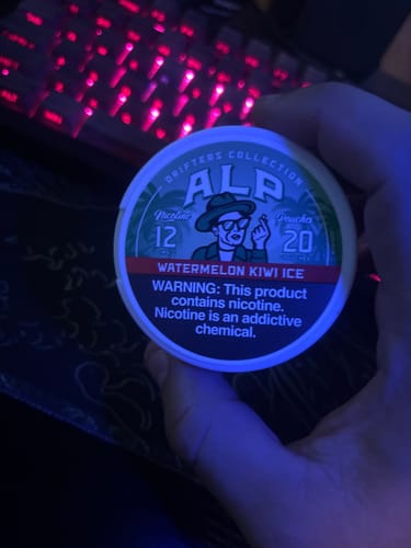 Customer holding a white tin of Drifters Watermelon Kiwi Ice Nicotine Pouches in their hand.