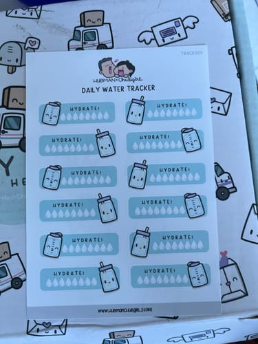 A customer's sheet of Daily Water Tracker Planner Stickers showing all 12 individual tracker designs on a decorative background.