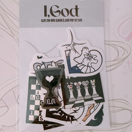 Customer's XLOV "I,God" official MD sticker set in its original clear packaging.
