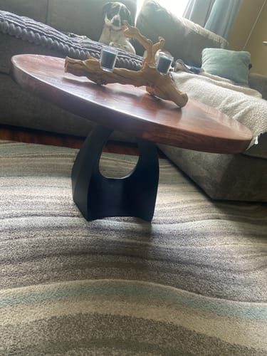 Customer's black Coffee Table Base 121 Tulipe with a custom wooden oval top in a living room.