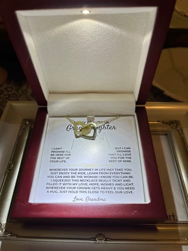 Reviewer's replacement message card for a granddaughter, shown with a necklace in a lighted gift box.