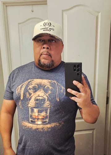 A reviewer takes a mirror selfie wearing the heather grey Whiskey Labrador Grunge T-Shirt.