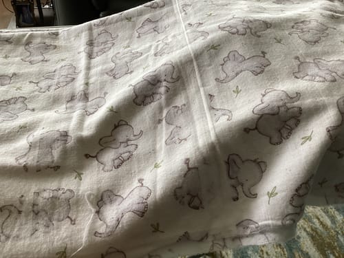 Customer's photo of the brushed cotton fabric showing the smudged and misprinted baby elephant pattern.