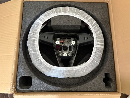 Customer photo review of Custom Dry Carbon Fiber Steering Wheel Replacement for Tesla Model Y 2026 Juniper