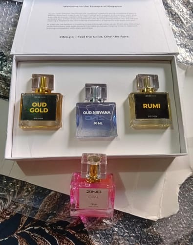 Reviewer's Royal oud Collection showing the Oud Gold and Rumi perfumes in a white presentation box.