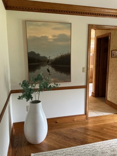 Customer's Misty Reflection Canvas Art hanging on a wall in their dining room, adding a peaceful mood to the space.