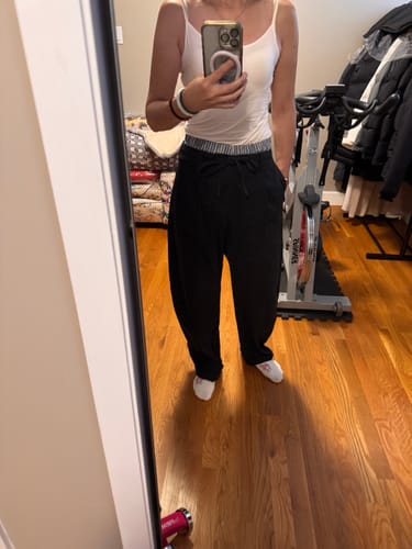 Reviewer showing the front view of the Contrast Trim Barrel Leg Pants, highlighting the relaxed fit.