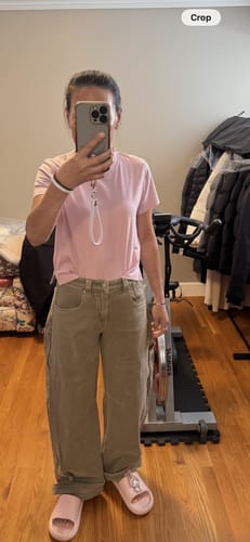 Reviewer standing in a room, showing the full-length fit of the khaki Barrel Leg Jeans.