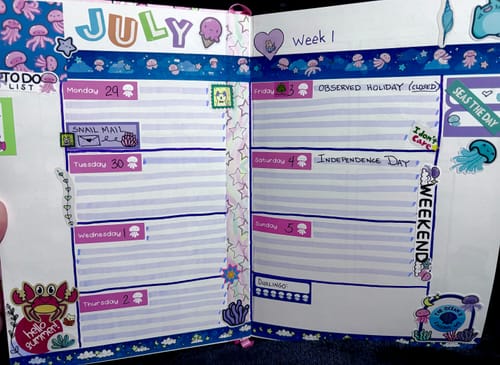 Customer's planner spread for July decorated with colorful stickers and washi tape from the Dreamy Jellies Bonus Box Set.