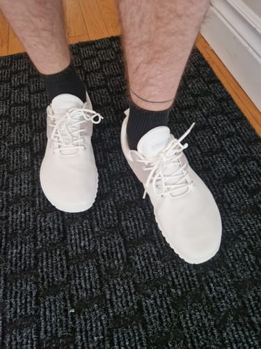 Reviewer's white Wish Ⅰ - Barefoot Shoes worn with black socks, seen from a top-down angle.