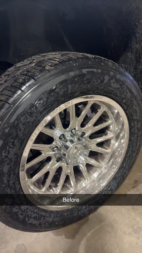 Reviewer's 'Before' photo of their chrome wheel with standard lug nuts.