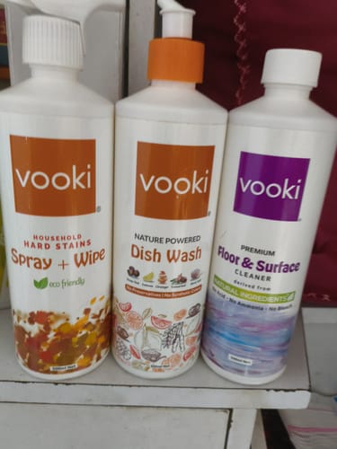 Reviewer's Ultimate Kitchen Cleaning Combo Pack, showing the hard stain spray, dish wash, and floor cleaner bottles.