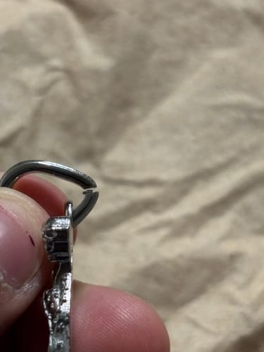 Customer's close-up of the Santa Muerte Pendant, showing the unclosed jump ring at the top.