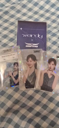 Customer's three holographic Red Velvet Wendy Sudden Attack photocards displayed with their backing card.