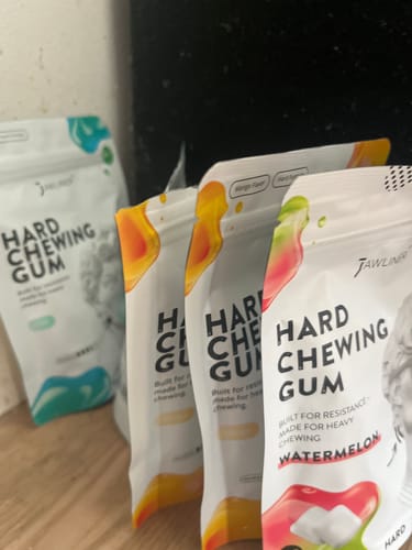 Customer's collection of Hard Gum bags in various flavors lined up on a surface.