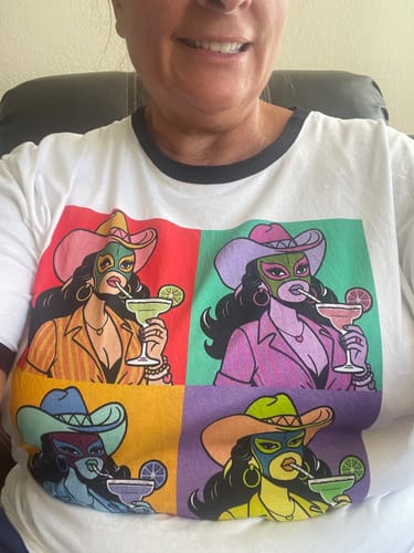 Customer wearing the Margarita Mama Vintage Ringer Tee, showing the colorful pop-art style graphic.