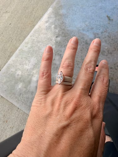 Reviewer's hand wearing the stacked Marquise Cut Silicone Ring Set with a large marquise-cut stone.