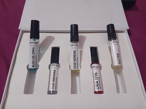 Customer's Make Your Own Tester Pack with five assorted perfume testers displayed in an open white box.
