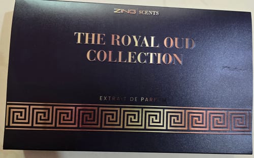 Customer's black and gold box for 'The Royal Oud Collection' perfume set.