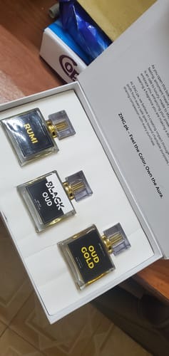 Customer's Royal Oud Collection showing the Rumi, Black Oud, and Oud Gold perfume bottles inside a white box.