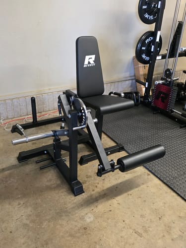 Customer's fully assembled RitFit PLC01 Leg Extension Curl Machine in a home gym.