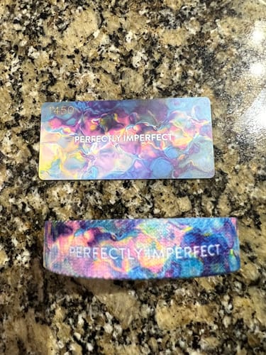 Customer's colorful Perfectly Imperfect Bracelet and matching card laid out on a granite countertop.