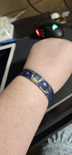 Reviewer wearing the Stay Curious Cat Bracelet, showing a close-up of the detailed cat's eye design.